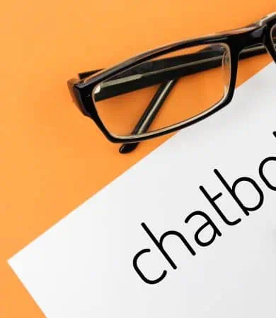 reading glasses and notebook with word chatbot on 2025 02 22 11 12 13 utc